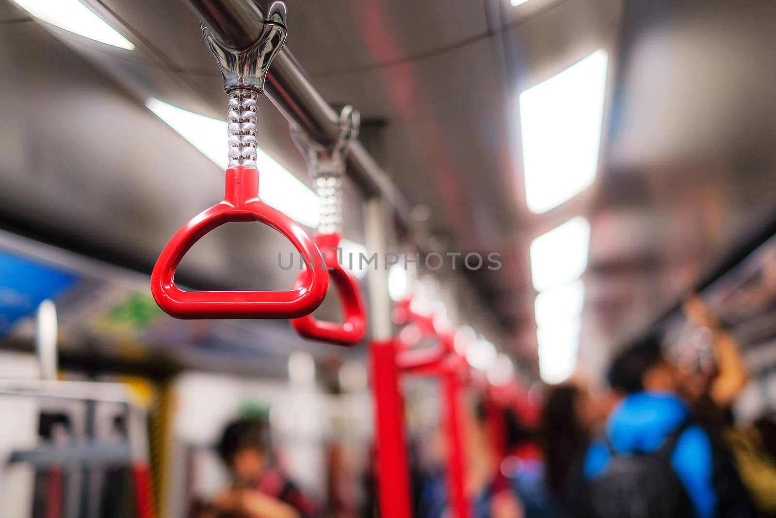 Handles for standing passenger in subway by Surasak