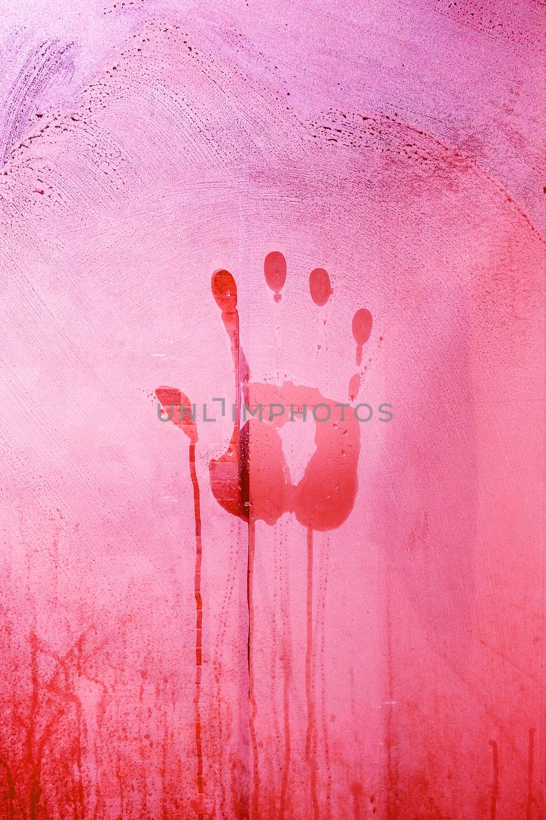 Red Hand Print on the Bathroom Mirror with Red tone of light by Surasak