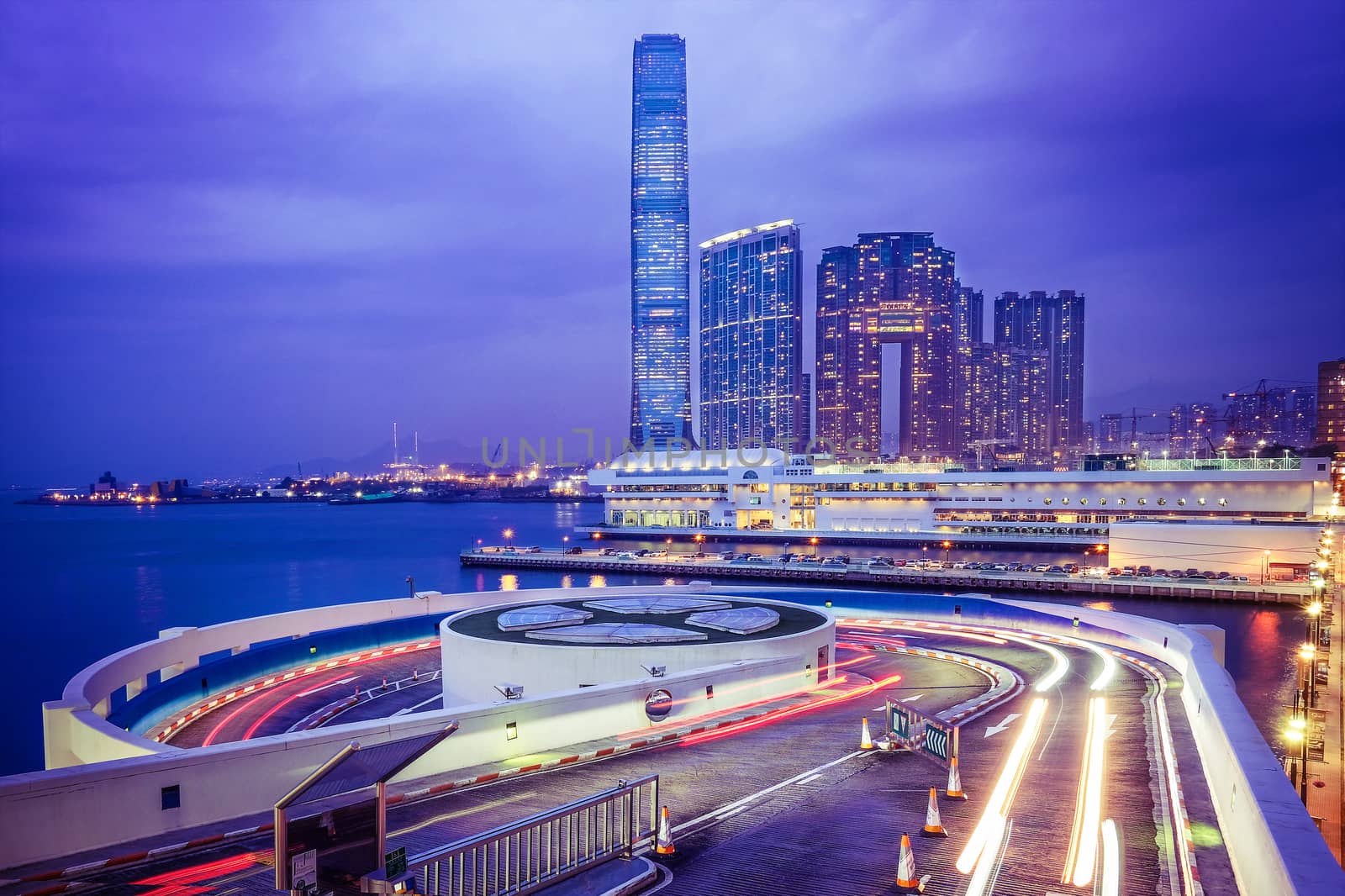 Night view traffic in Hong Kong at sunset time by Surasak