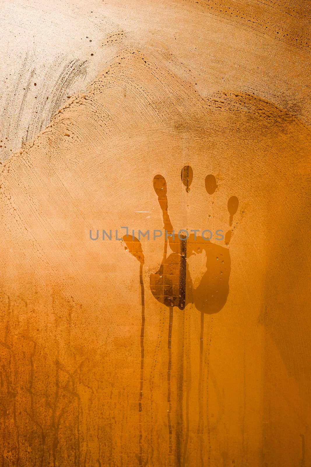 Mysterious Red Hand Print on the Bathroom Mirror with warm tone  by Surasak