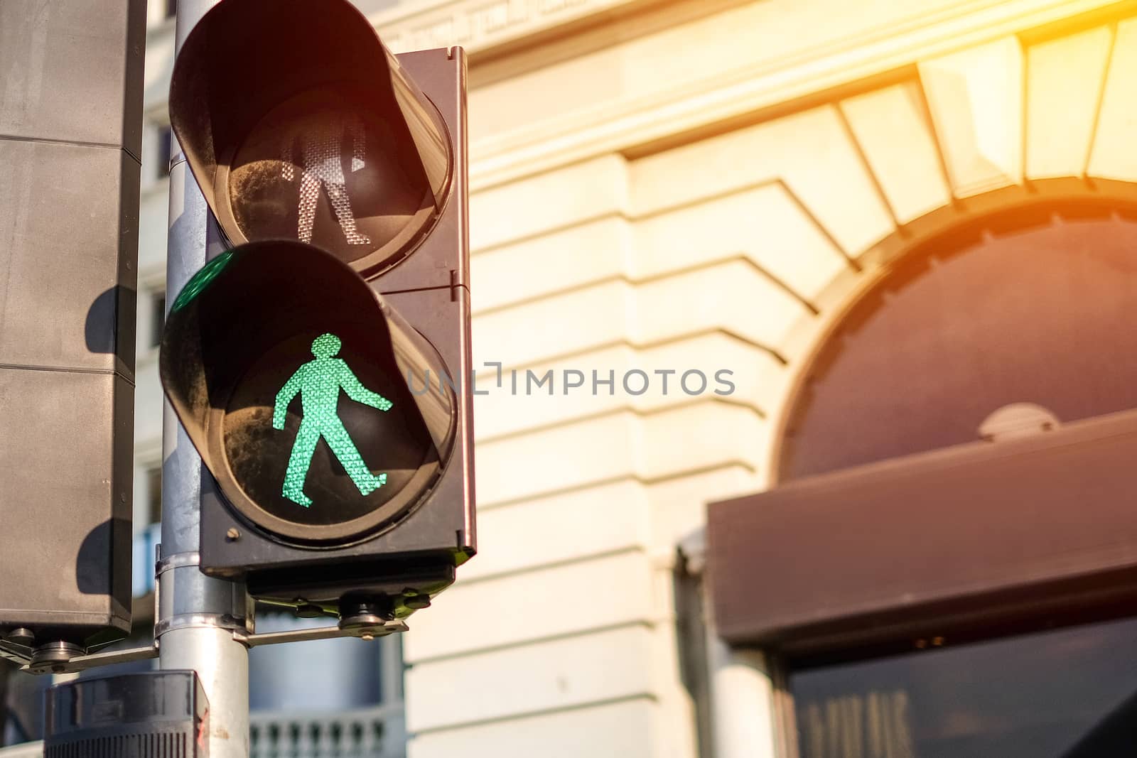 Traffic light on green in sunlight by Surasak