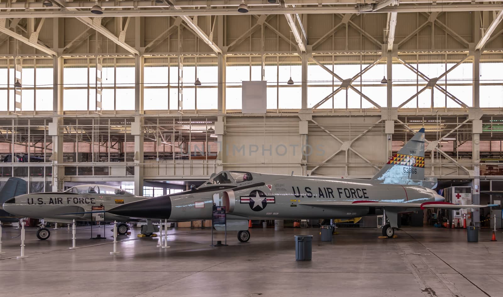 Oahu, Hawaii, USA. - January 10, 2020: Pearl Harbor Aviation Museum. Gray fighet jet 53366 in hangar. Beige roof. Natural light through windows.