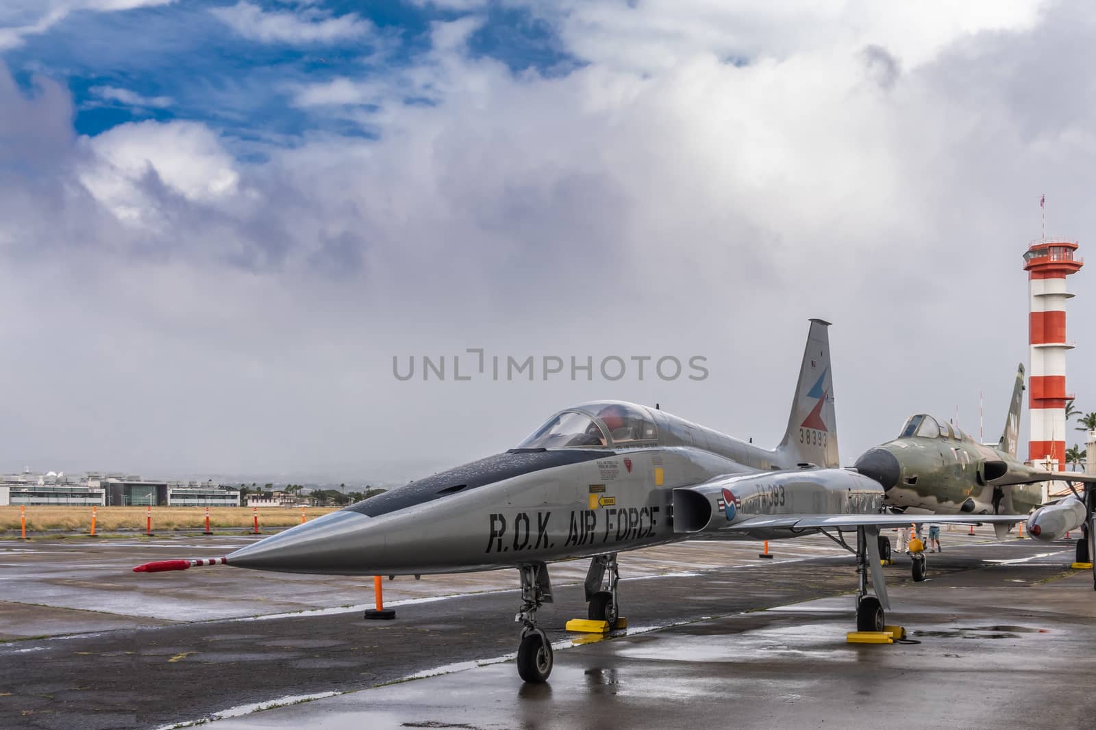 Oahu, Hawaii, USA. - January 10, 2020: Pearl Harbor Aviation Museum. Republic of Korea fighter jet on tarmac under cloudscape with blue patch.