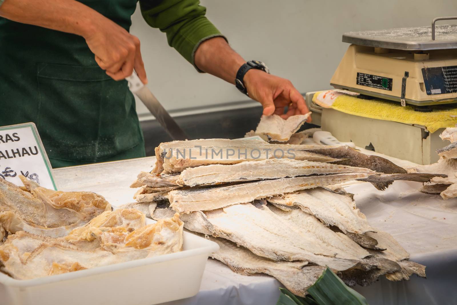 Quarteira, Portugal - May 2, 2018: display of salted and dried cod on the municipal market of the city on a spring day