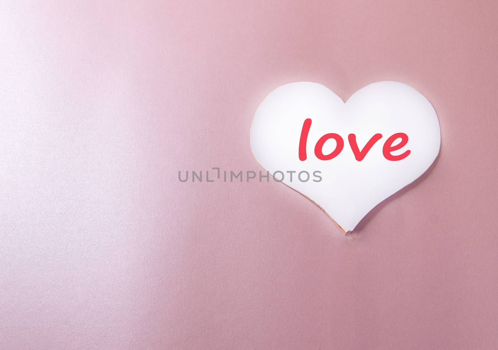 White background with paper heart and the words LOVE pink background heart, love, holiday greeting card, a minimum of creative idea of a holiday Valentine's day, space for copy by claire_lucia