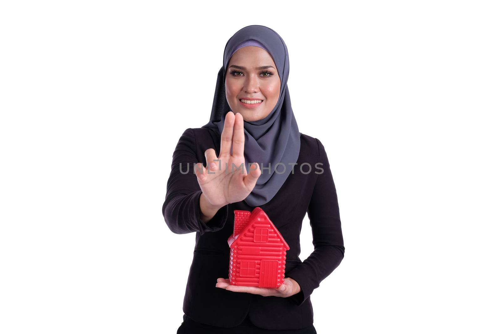 Young pretty Business muslim woman hold home icon for investment conceptual