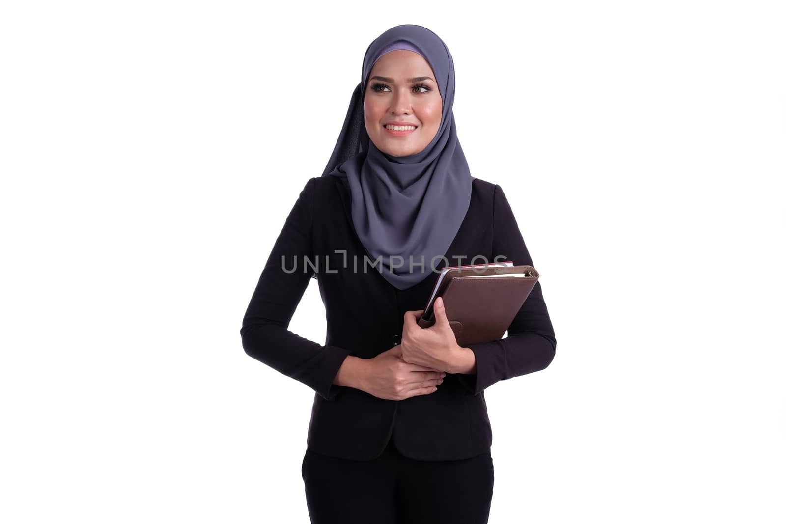 Attractive muslim business woman with finance diary