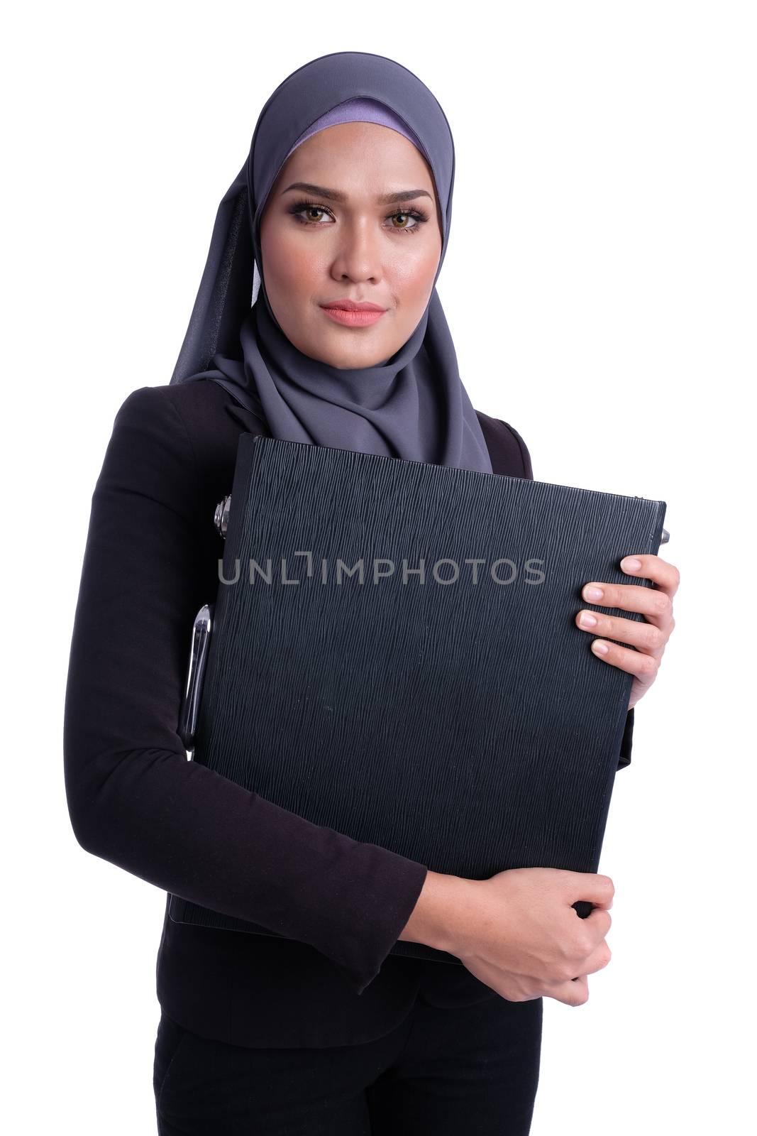 Pretty muslim business woman carrying bag by alkansari2020