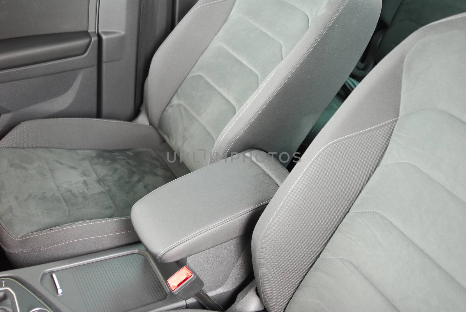 armrest in the luxury passenger car between the front seats by aselsa