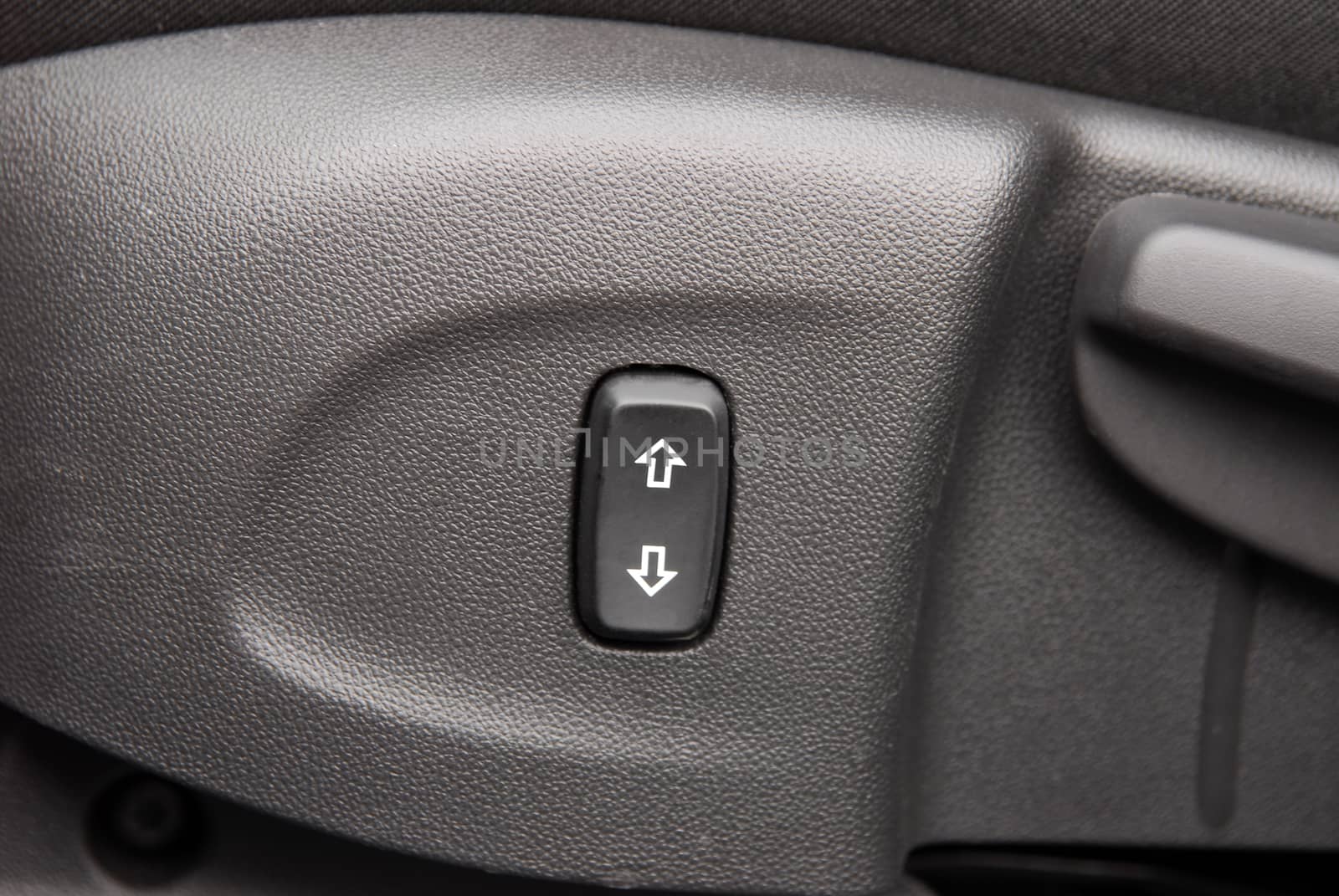 Buttons for adjusting seat position. Car interior detail
