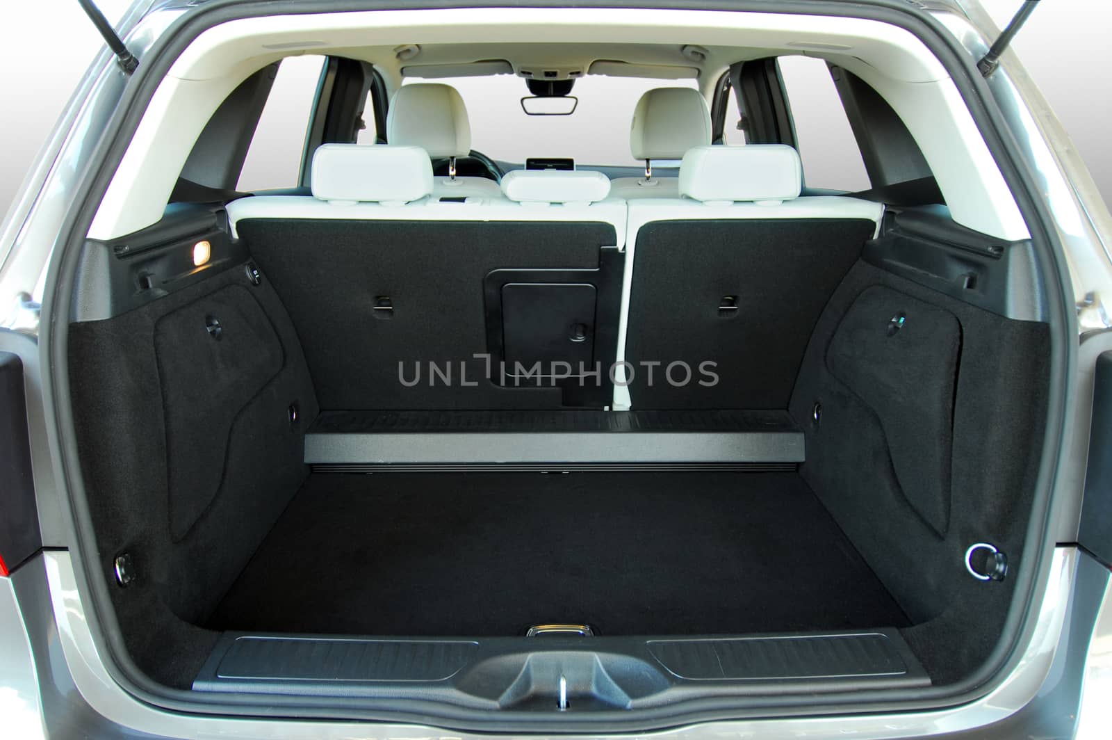 Empty trunk of the small white suv