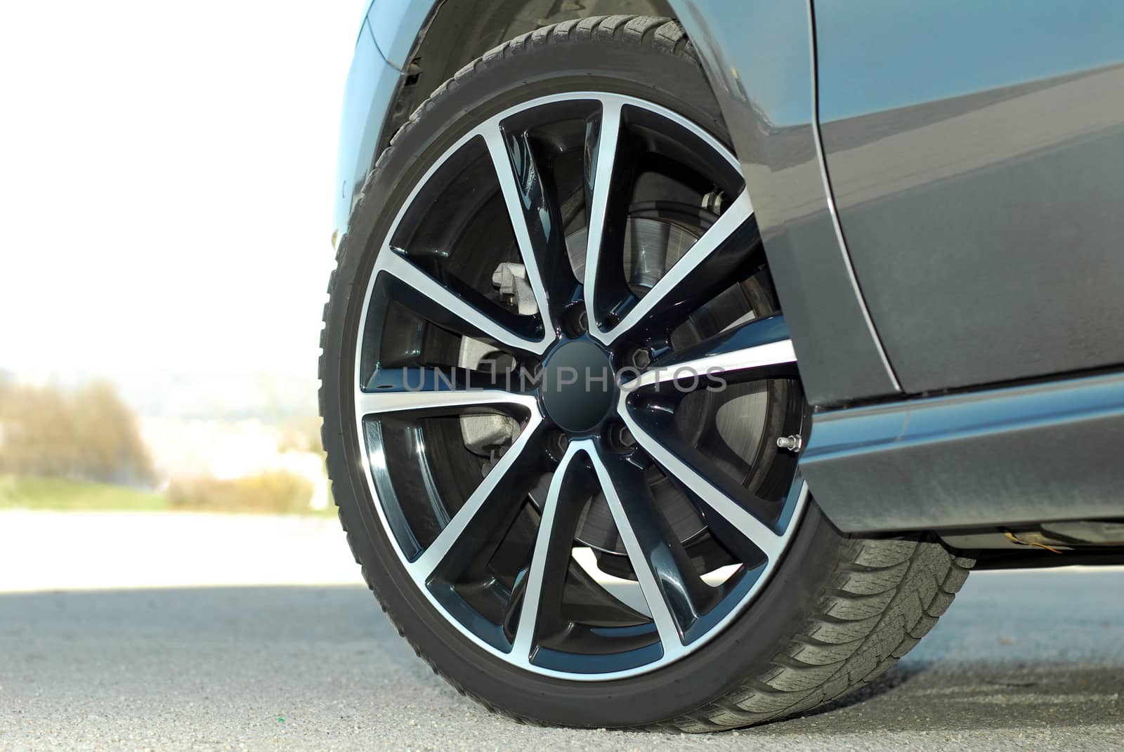 tire and alloy wheel on this small passenger car