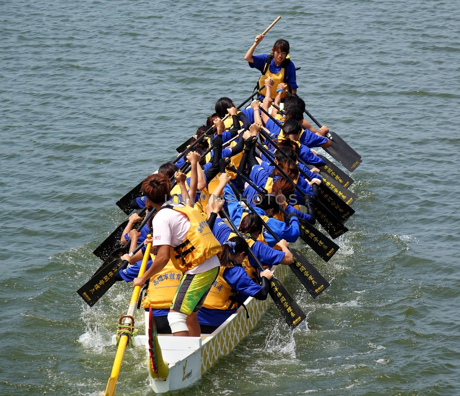KAOHSIUNG, TAIWAN -- JUNE 1, 2014: An unidentified team takes part in the 2014 Dragon Boat Event on the Lotus Lake.