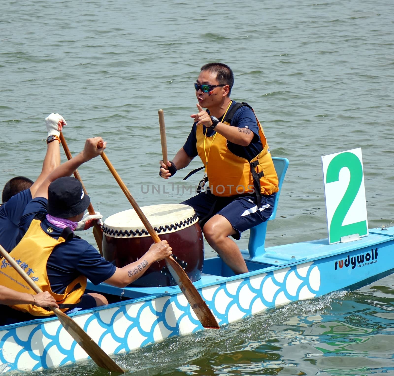 KAOHSIUNG, TAIWAN -- JUNE 1, 2014: An unidentified team takes part in the 2014 Dragon Boat Event on the Lotus Lake.