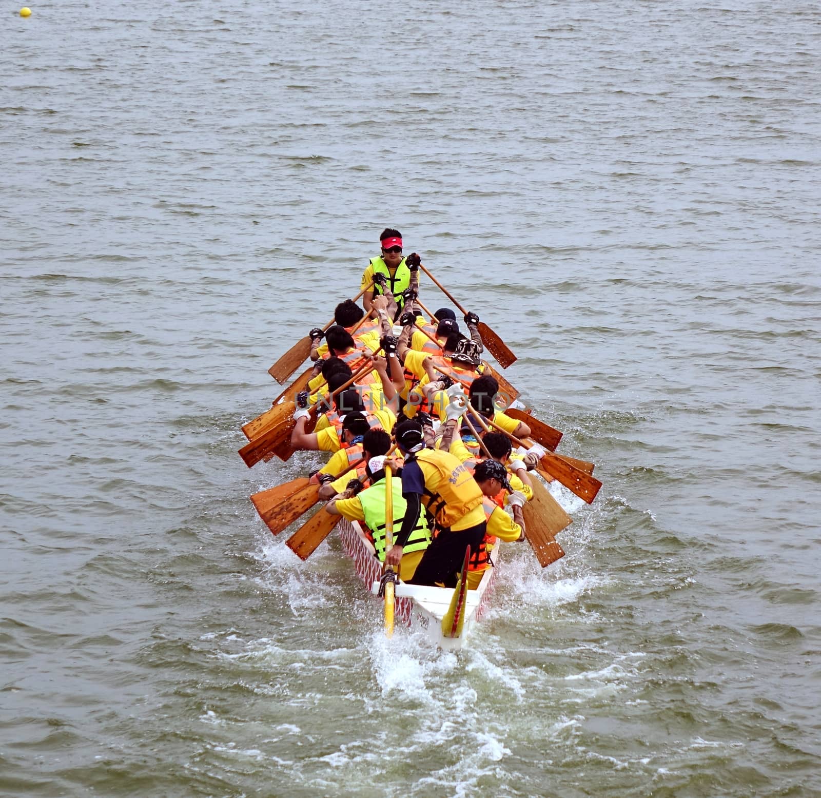 KAOHSIUNG, TAIWAN - MAY 25, 2014: An unidentified team competes in the 2014 Dragon Boat Races on the Lotus Lake.