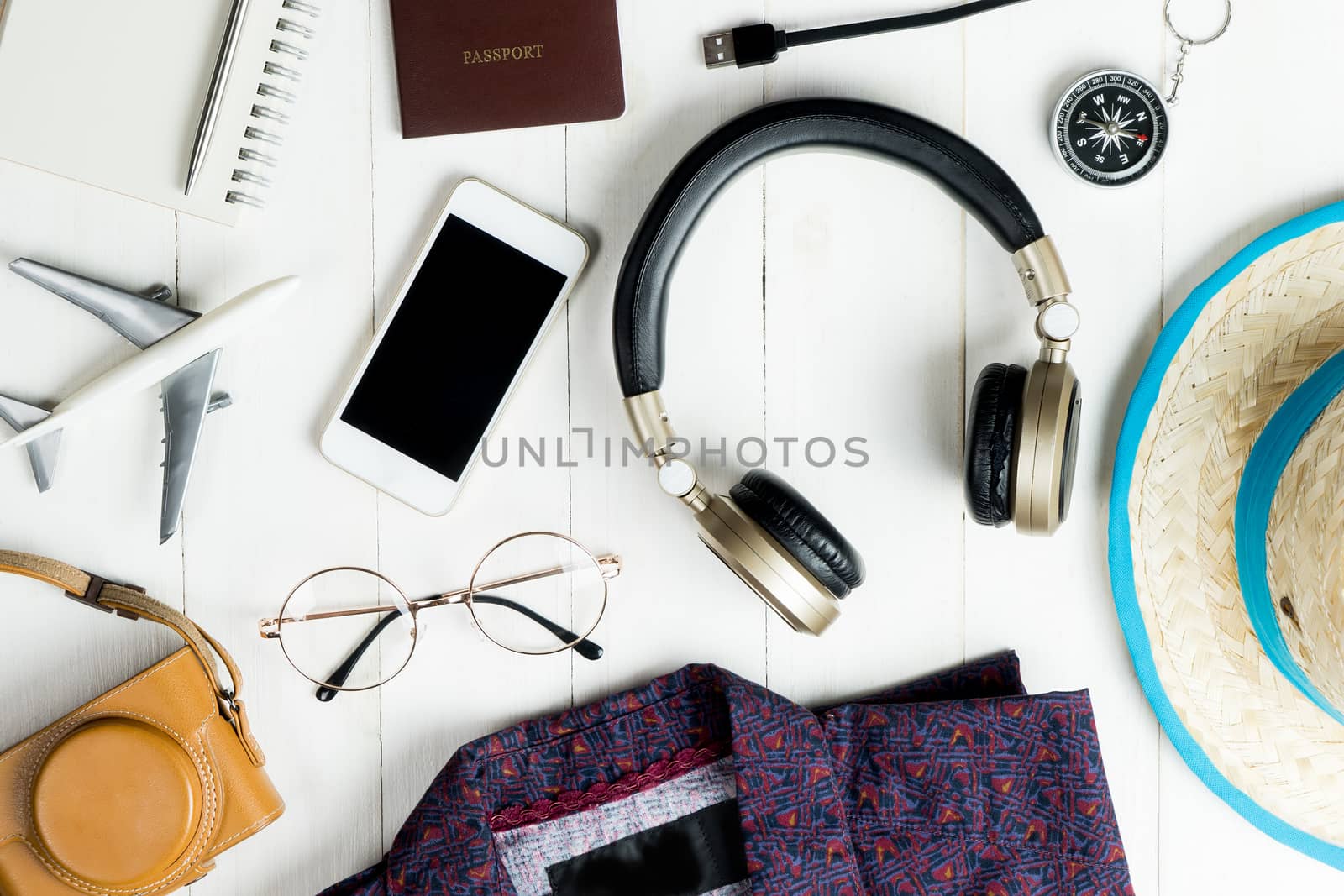 Travel accessories and fashion flatlay on white wooden with copy space