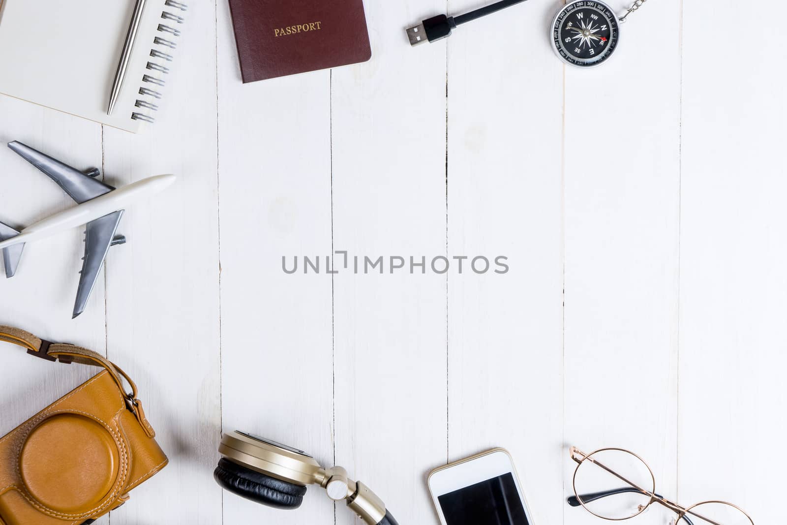 Travel accessories and gadget on whtie wooden copy space by junce