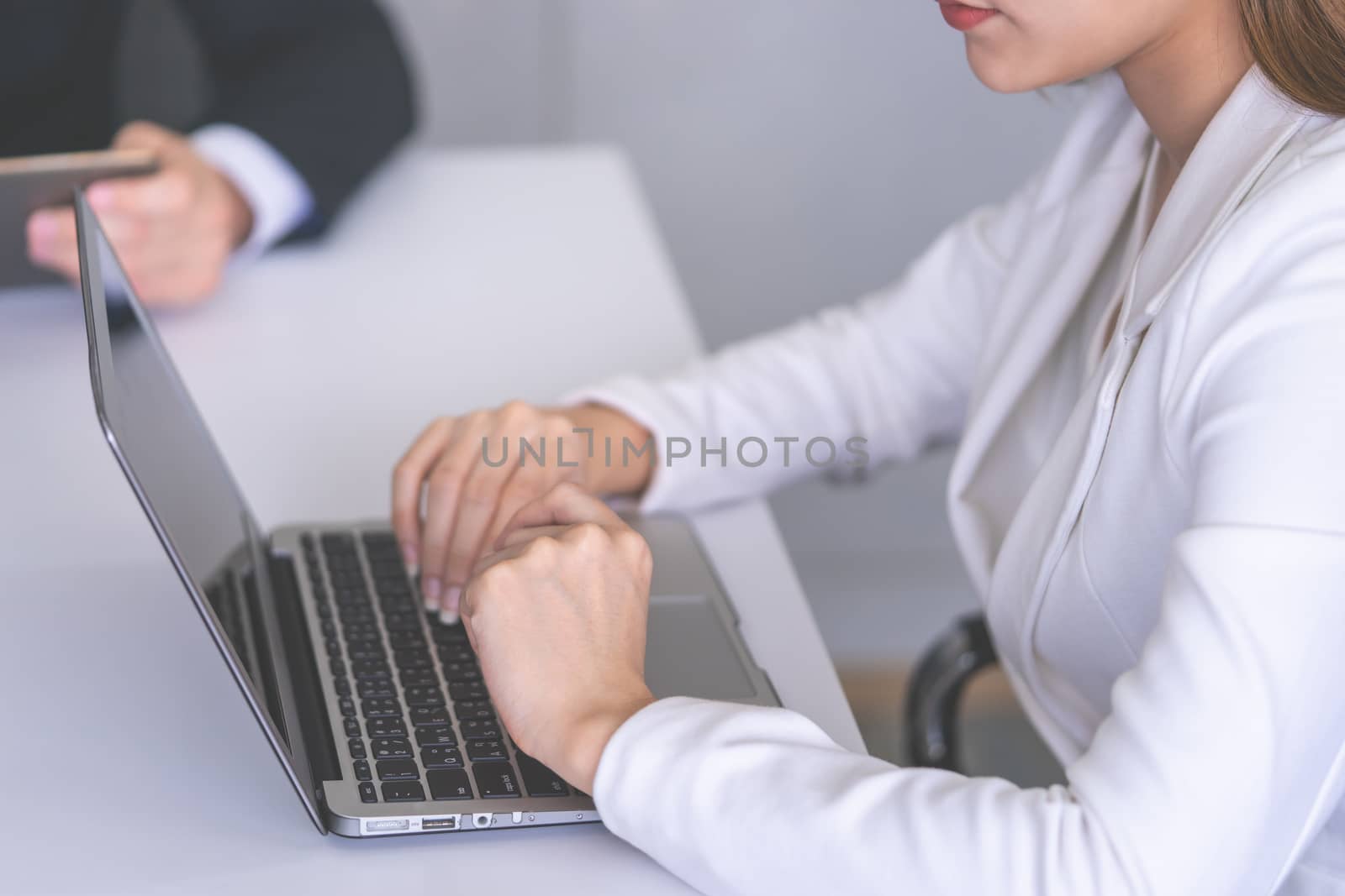 Office woman hand is typing on business computer by junce