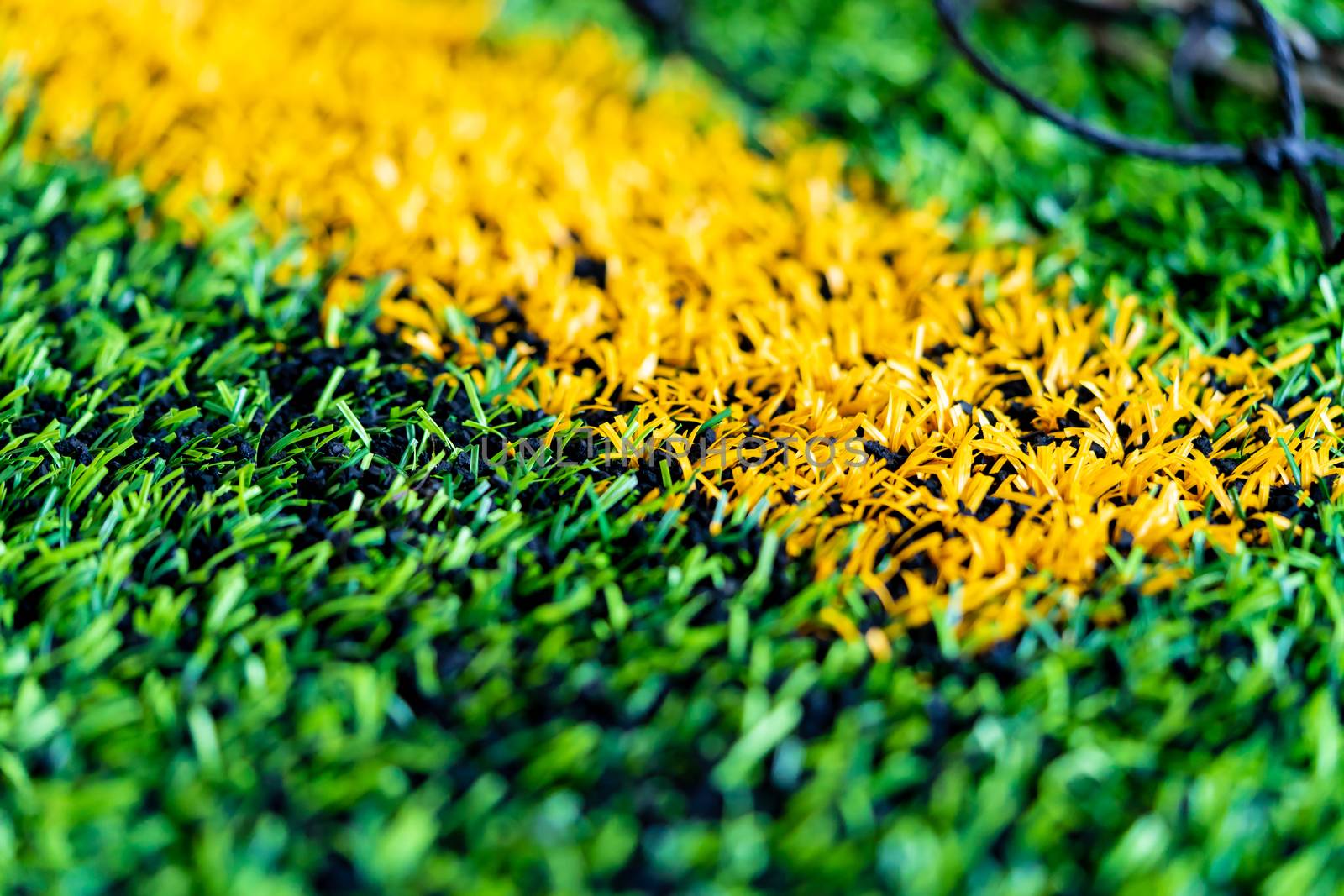 Yellow Boundary Line of an indoor football soccer training field by junce