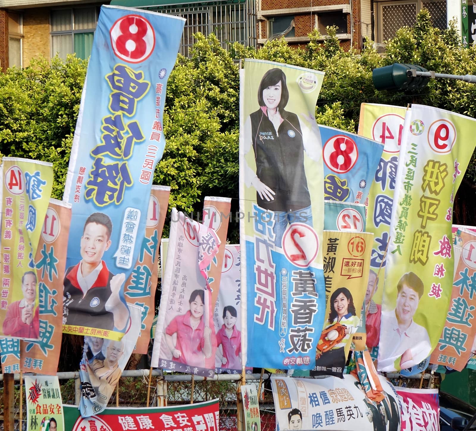 KAOHSIUNG, TAIWAN -- NOVEMBER 28, 2014: Local election 2014 in Taiwan. A veritable forest of election flags promotes the candidates of the various parties.