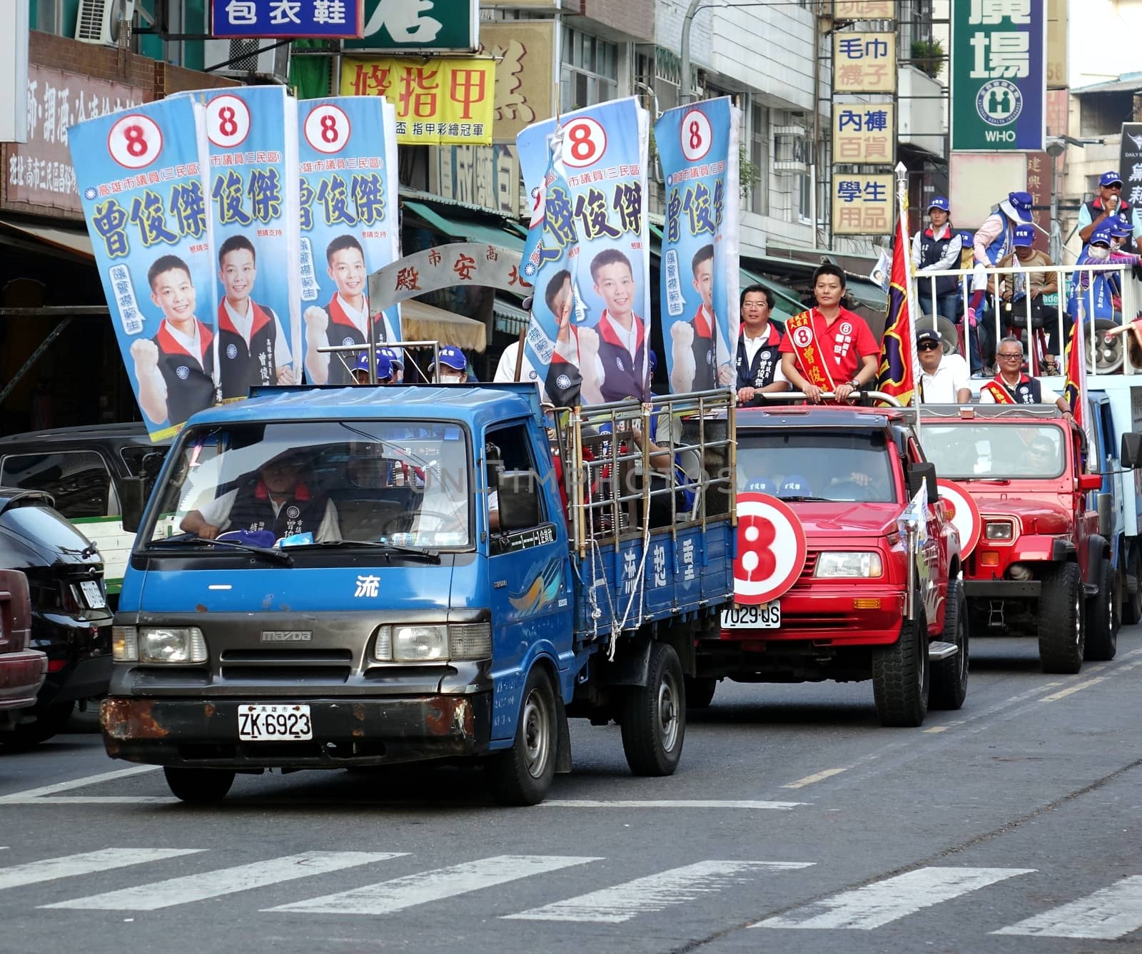 KAOHSIUNG, TAIWAN -- NOVEMBER 27, 2014: City council candidate Zeng Jun Jie parades through the streets in the run up to the local elections.