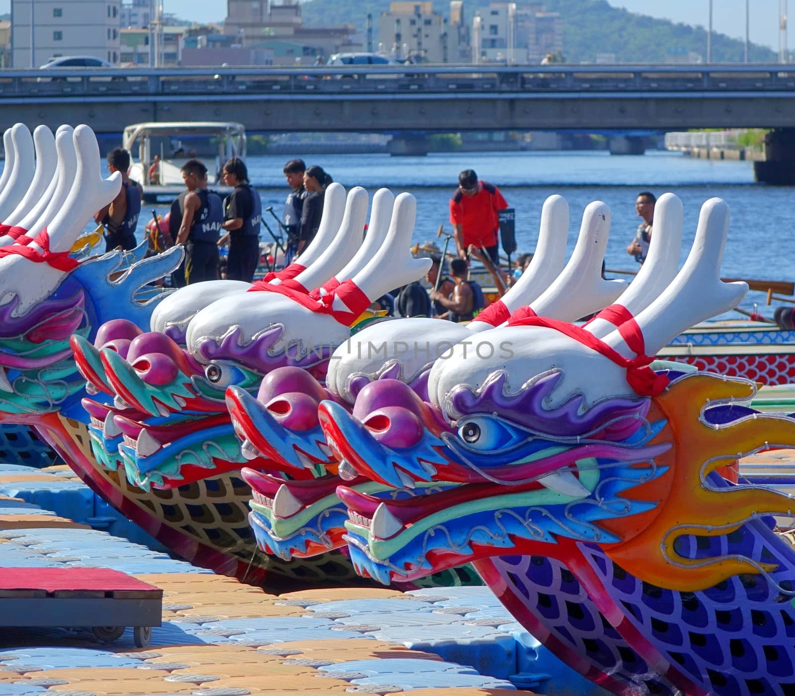 KAOHSIUNG, TAIWAN -- JUNE 14, 2015: Boats with the traditional dragon head sculpture design are prepared for the yearly Dragon Boat Races on the Love River.