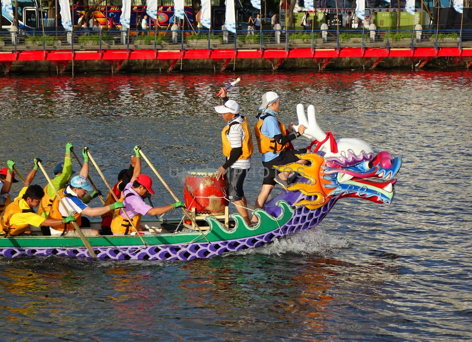 KAOHSIUNG, TAIWAN -- JUNE 14, 2015: An unidentified team of rowers trains for the upcoming Dragon Boat Races on the Love River.