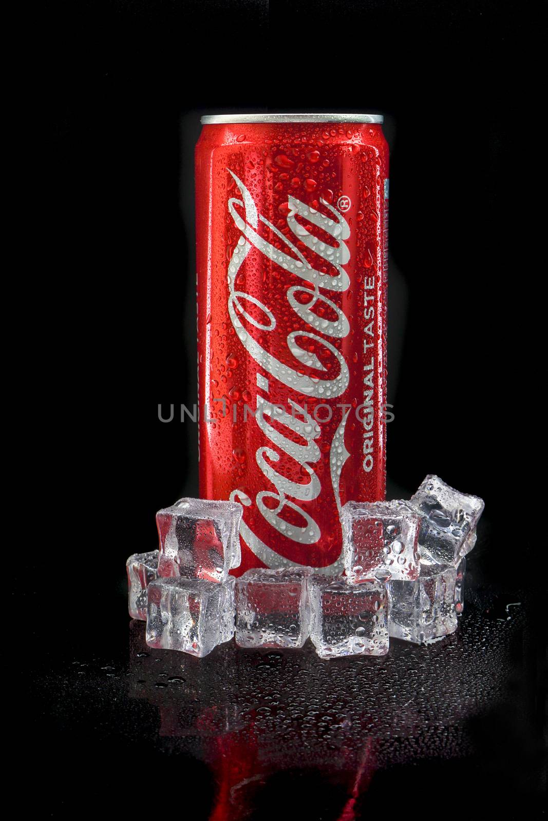 Kuala Lumpur, Malaysia - March 5, 2020 : Cola cola drink on black background. Coca Cola is competitor of Pepsi drink