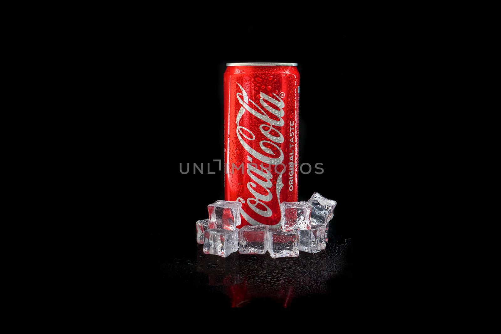 Kuala Lumpur, Malaysia - March 5, 2020 : Cola cola drink on black background. Coca Cola is competitor of Pepsi drink. Copy Space