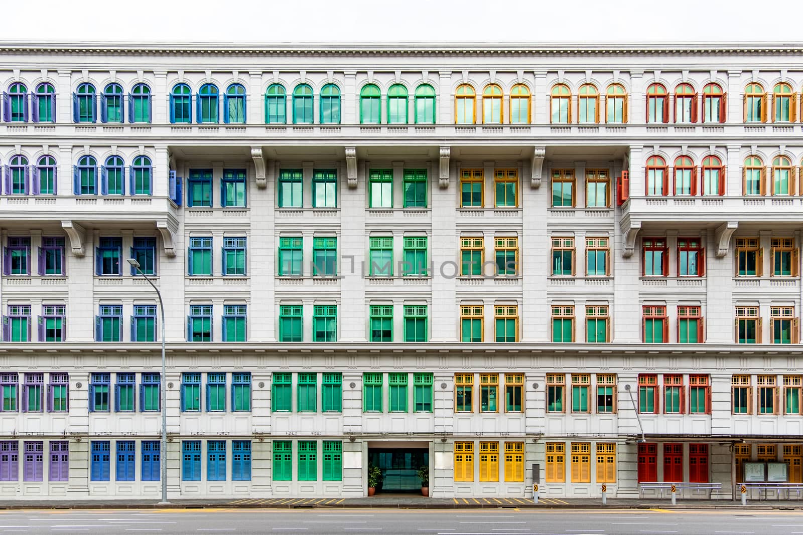 Colourful window shutters of the old building. by Tanarch