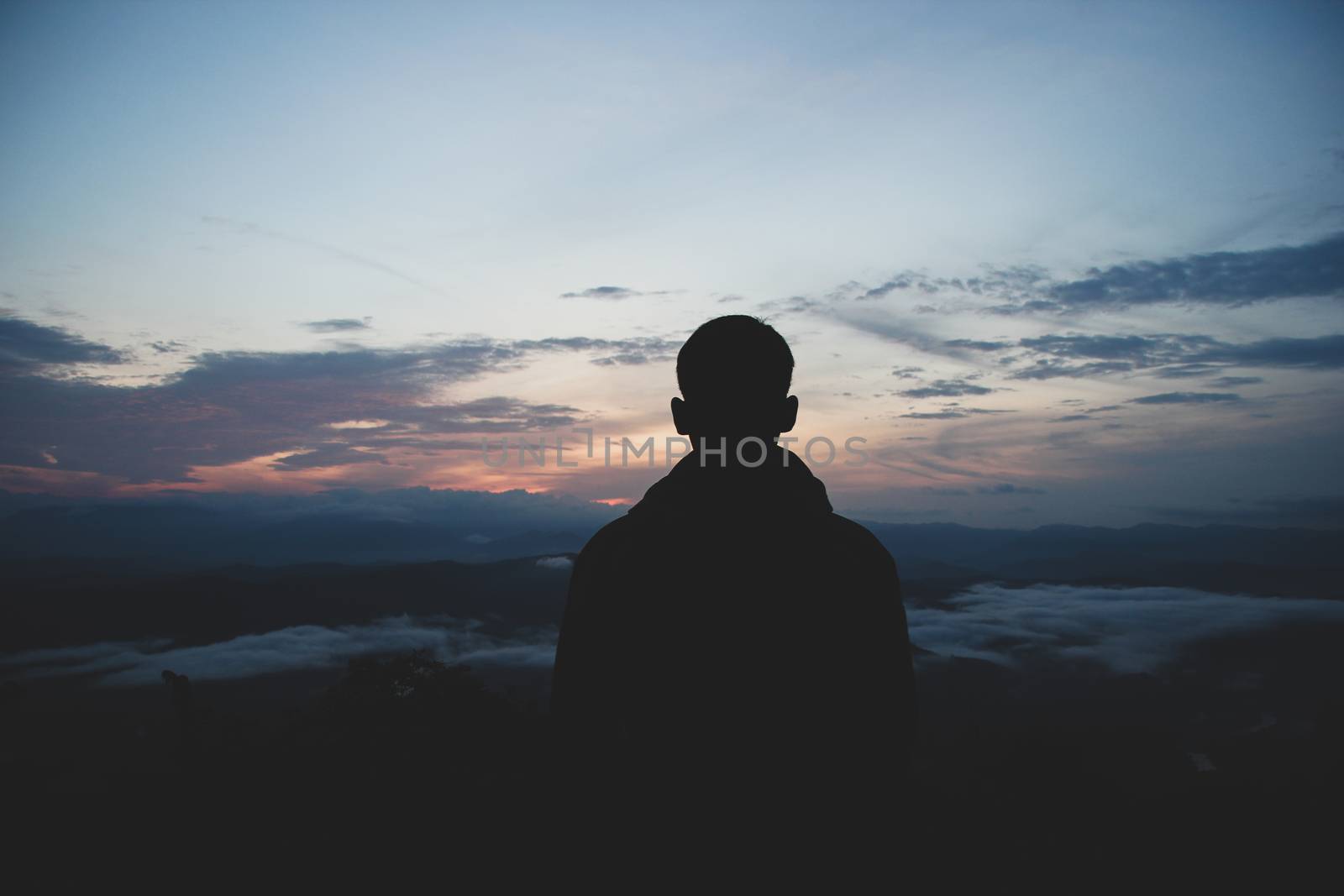 man is looking at the morning mist. At the Doi Samoe Dao National Park, NAN, Thailand