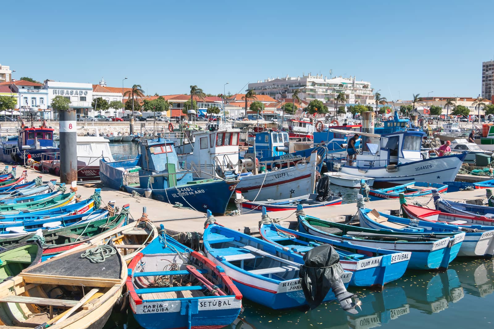 view of the small fishing port of Setubal with its typical blue  by AtlanticEUROSTOXX