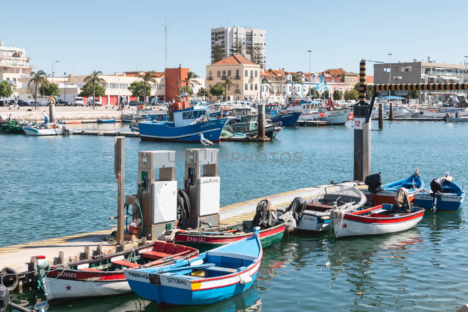 view of the small fishing port of Setubal with its typical blue  by AtlanticEUROSTOXX