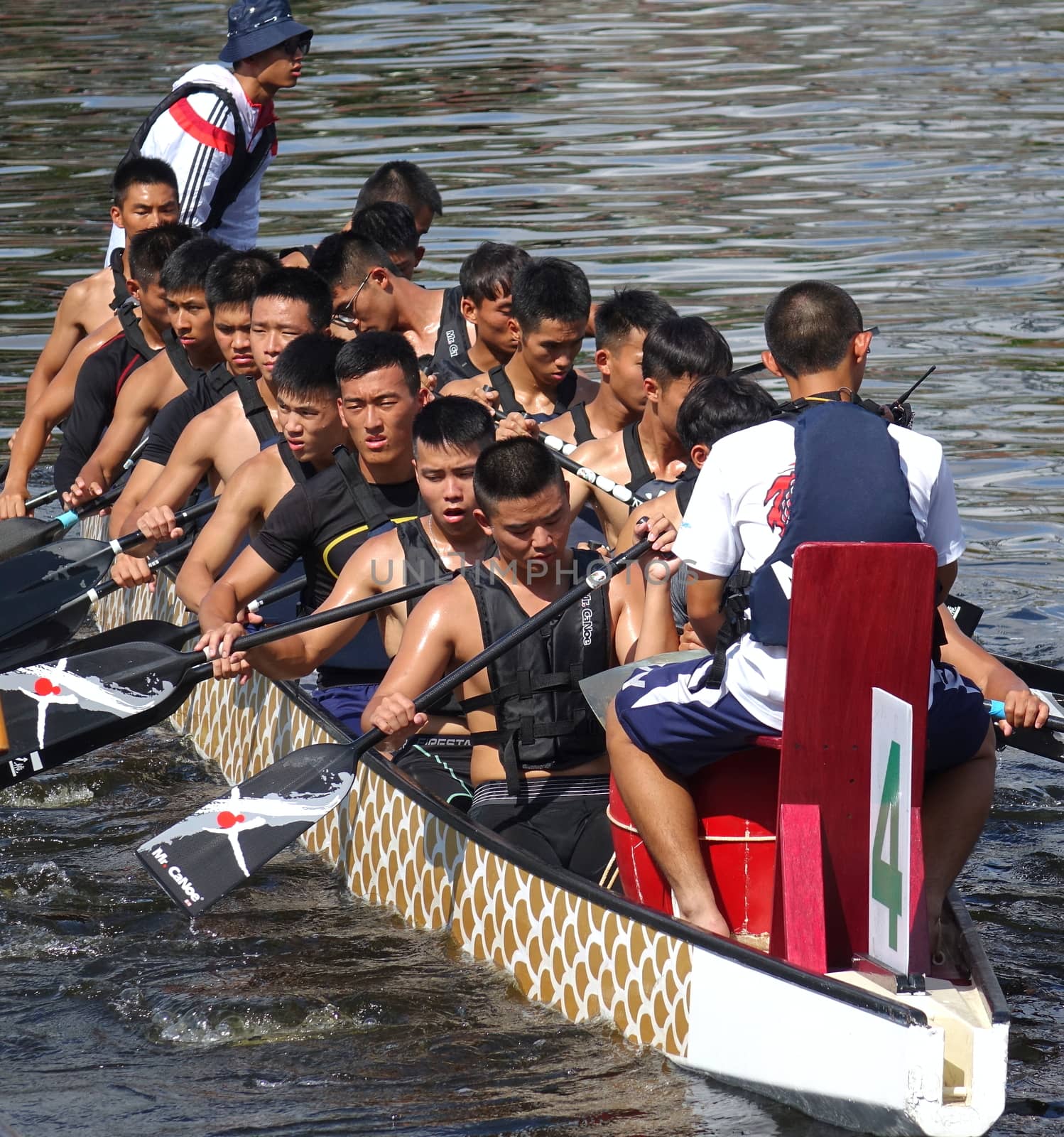 KAOHSIUNG, TAIWAN -- JUNE 10, 2018: A team of sailors from the navy prepares for the upcoming Dragon Boat Races.