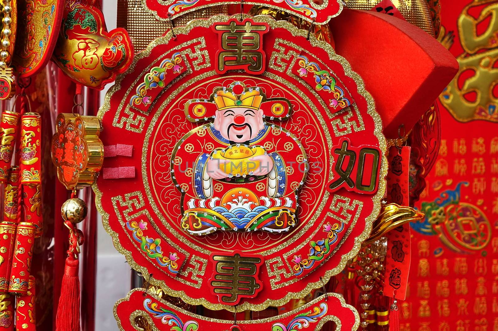 KAOHSIUNG, TAIWAN -- JANUARY 13, 2019: A store sells decorations for the Chinese New Year 2019. The image shows the God of Wealth and proverbs for good luck.
