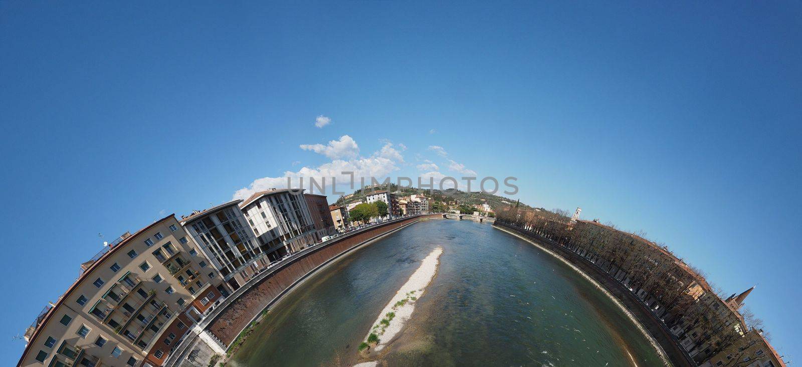 Little planet view of the city of Verona, Italy seen from the river