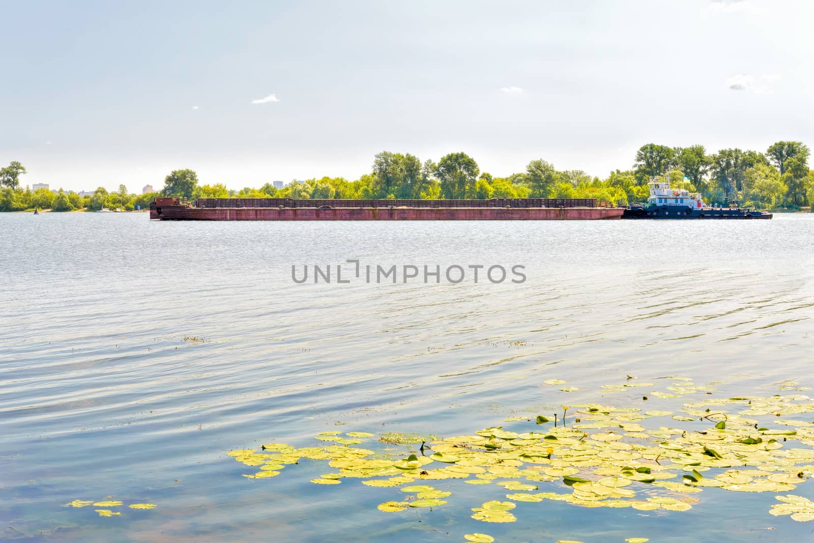 Barge on the Dnieper river during a sunny summer day