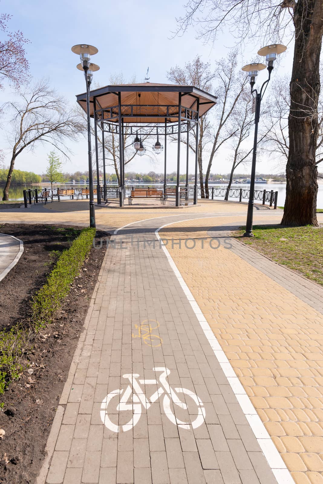 White bike path sign painted on a lane in the Natalka park of Kiev, Ukraine