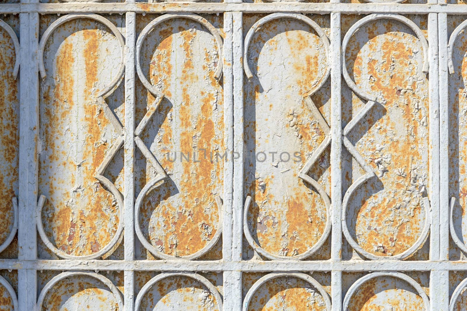 Close up of the ornaments on an old rust metallic portal