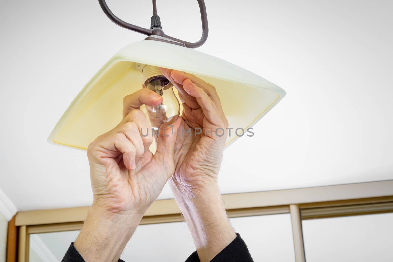 Man Installing a Bulb by MaxalTamor