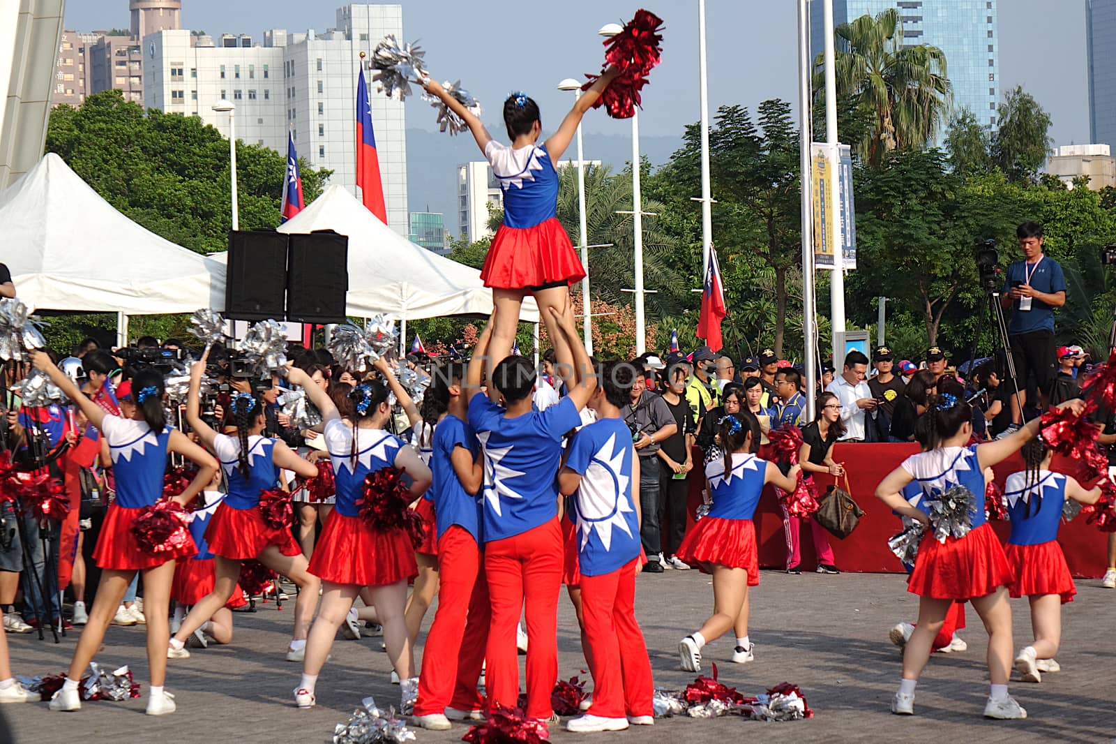 KAOHSIUNG, TAIWAN -- OCTOBER 10, 2019: Cheerleaders dressed in national flag colors perform as part of the national day celebrations at a free, public event. 
