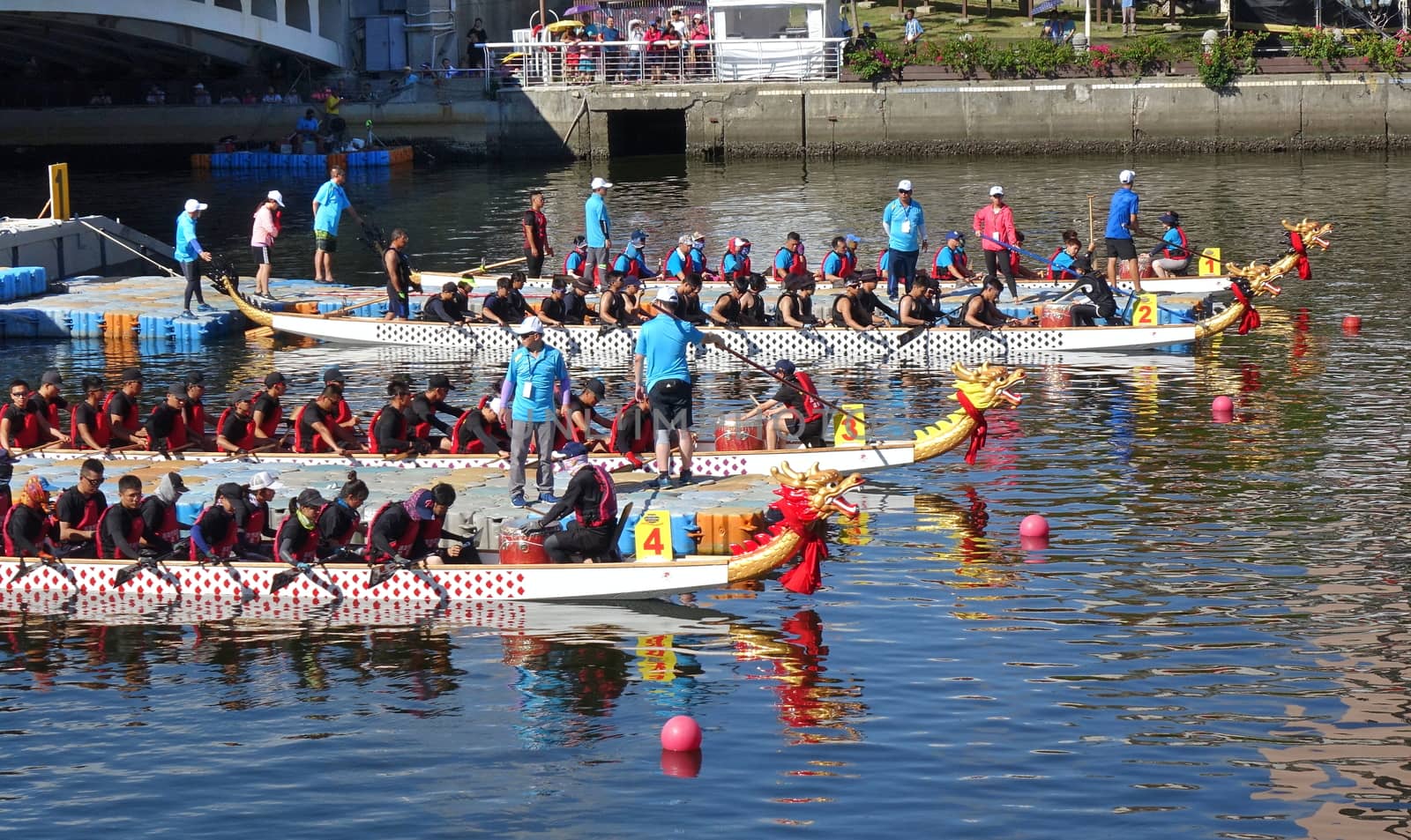 KAOHSIUNG, TAIWAN -- JUNE 7, 2019: Teams are positioning themselves at the starting line for the Love River dragon boat races.