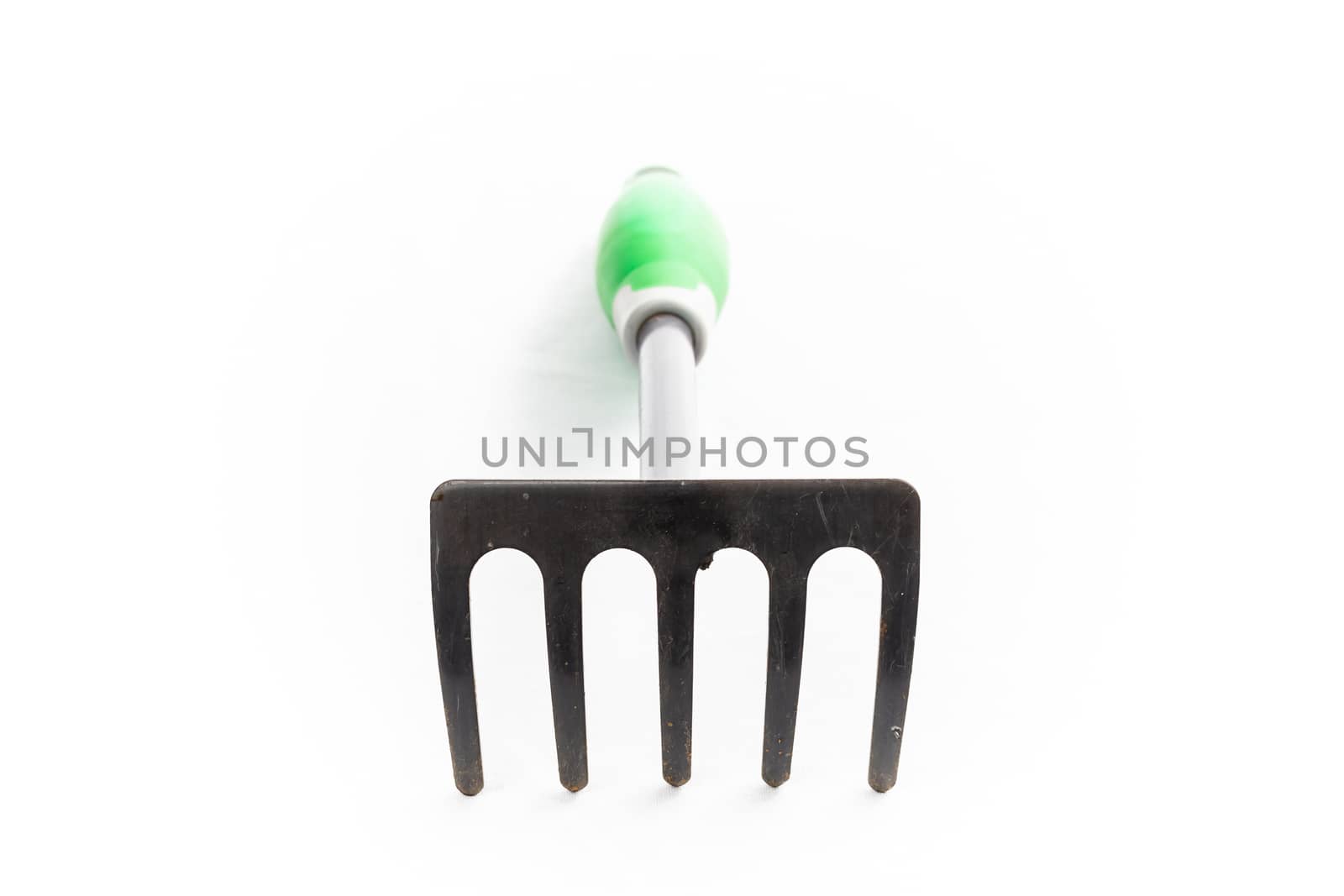 small rake gardening 5 teeth with green handle on white background