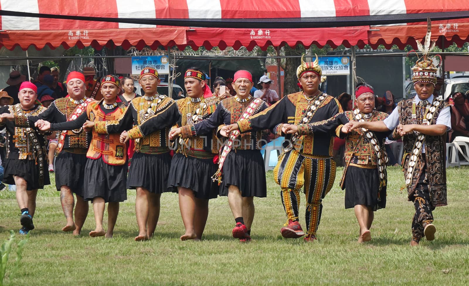 KAOHSIUNG, TAIWAN -- SEPTEMBER 28, 2019: Male members of the indigenous Rukai tribe perform a dance during the traditional harvest festival.