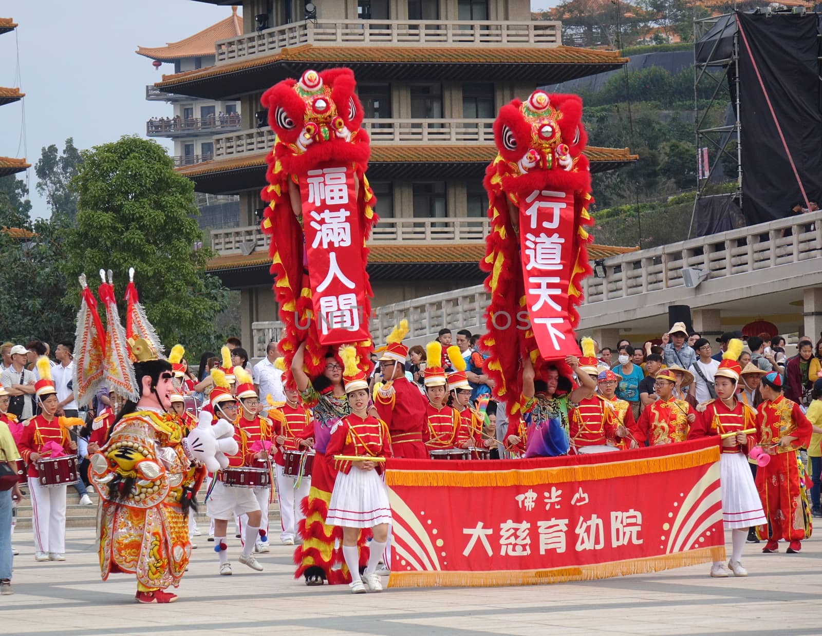KAOHSIUNG, TAIWAN -- JANUARY 25, 2020: A parade at the Fo Guang Shan Buddhist complex during Chinese New Year. The Chinese characters mean "Da Zi Children's Home" and "Blessing for the New Year".