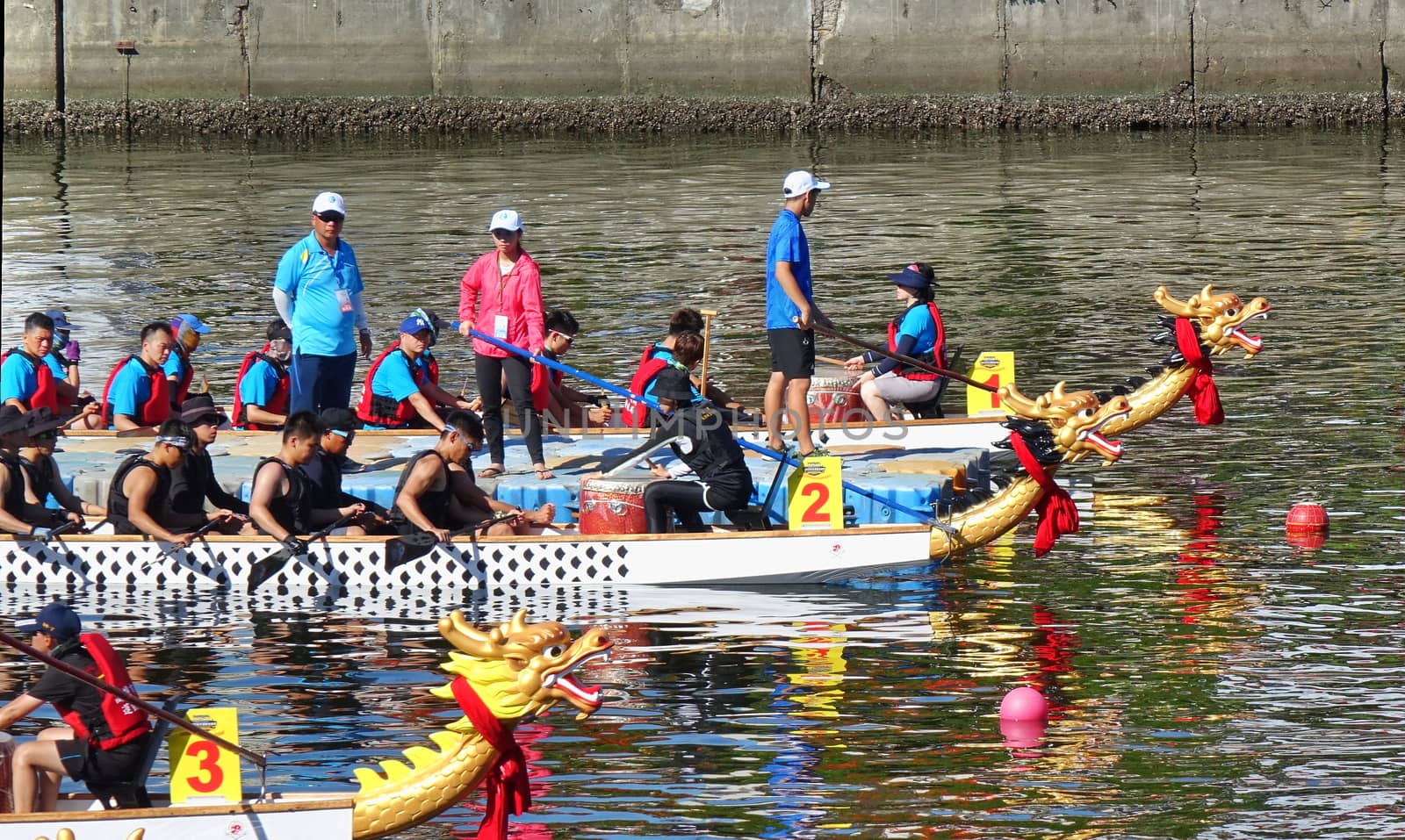 KAOHSIUNG, TAIWAN -- JUNE 7, 2019: Teams are positioning themselves at the starting line for the Love River dragon boat races.

