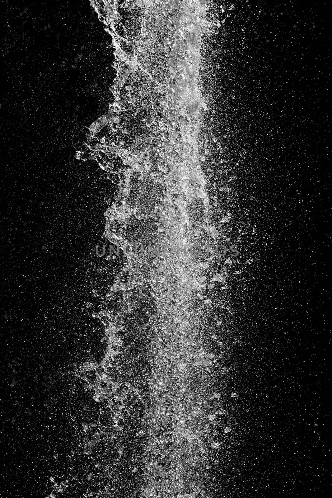 Splash of pouring water isolated over black background