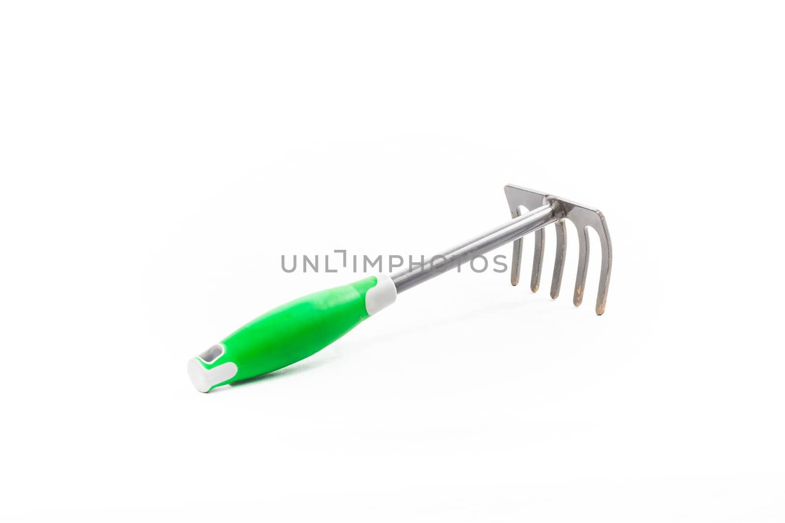 small rake gardening 5 teeth with green handle on white background