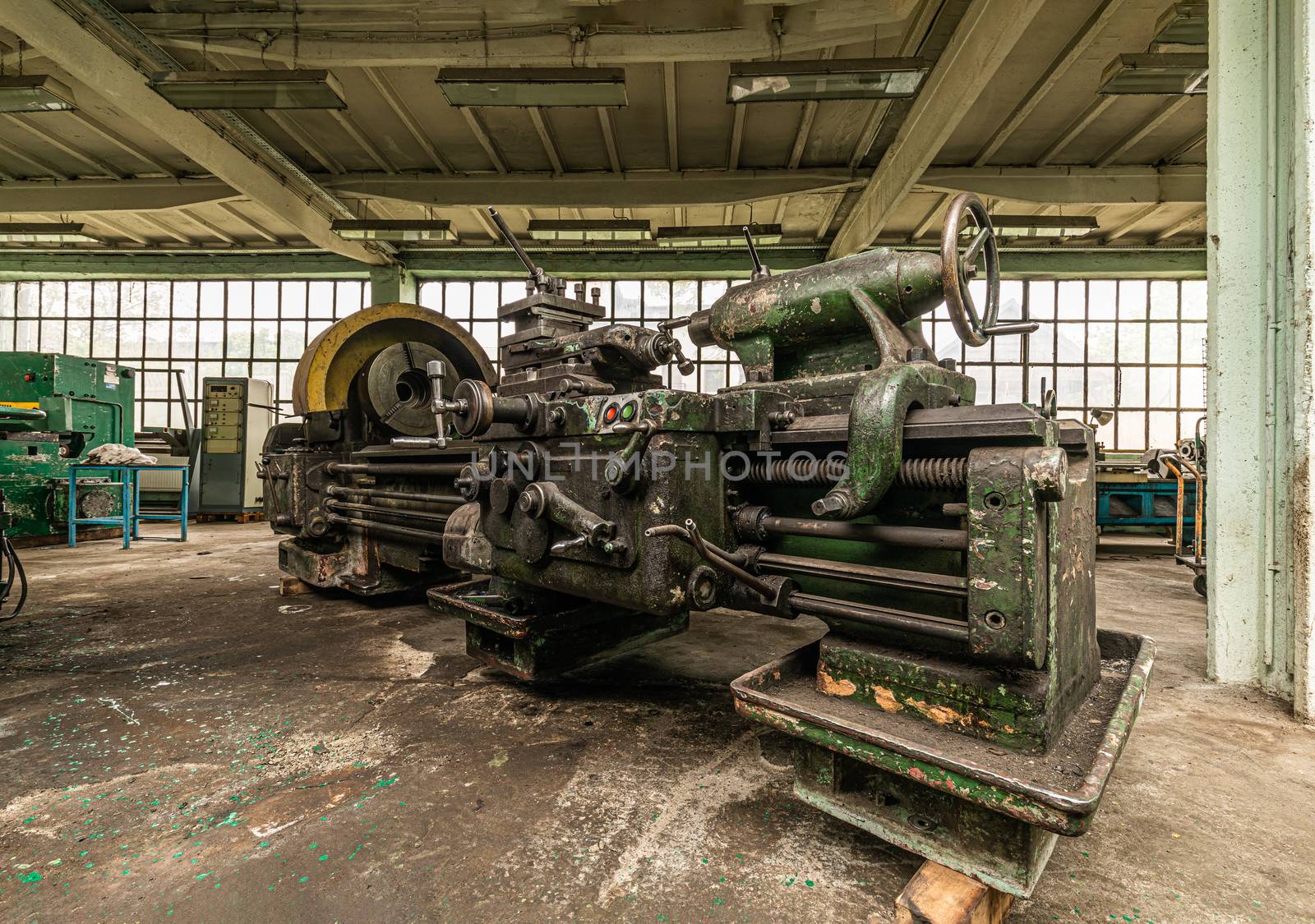 Big old lathe in ironworks factory by mkenwoo