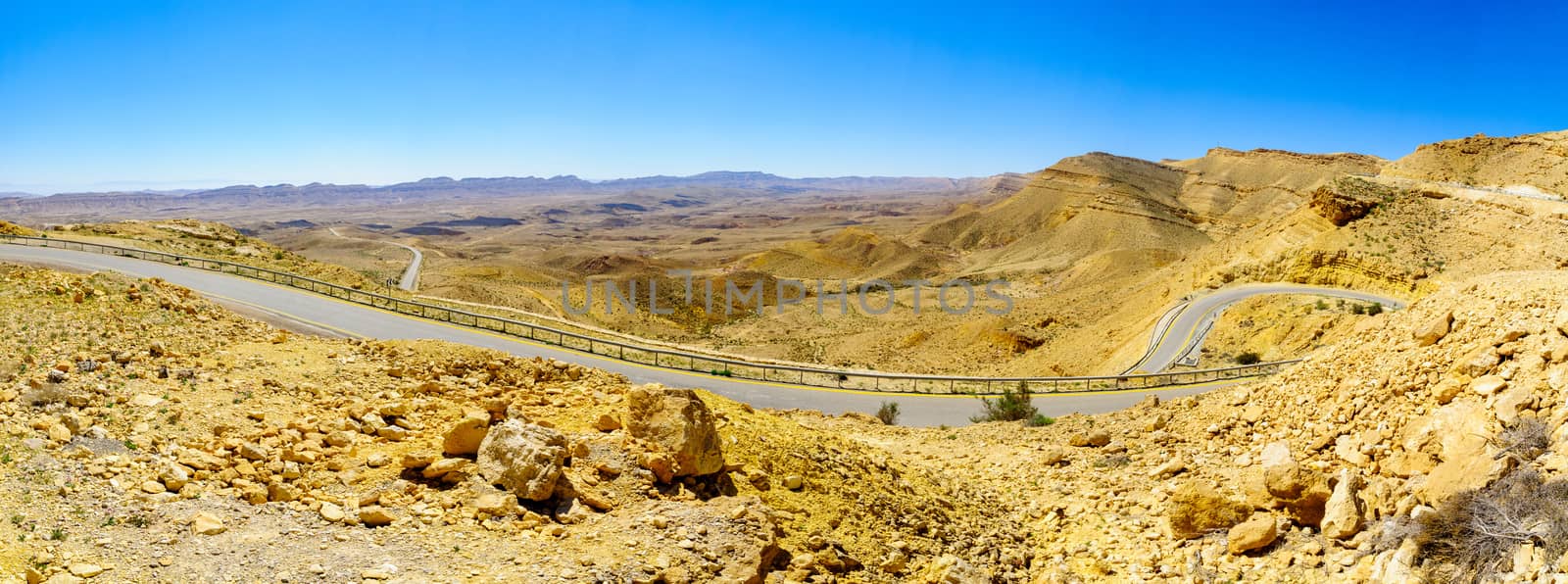 Panoramic landscape and winding road 225 in HaMakhtesh HaGadol (the big crater). It is a geological erosional landform in the Negev desert, Southern Israel